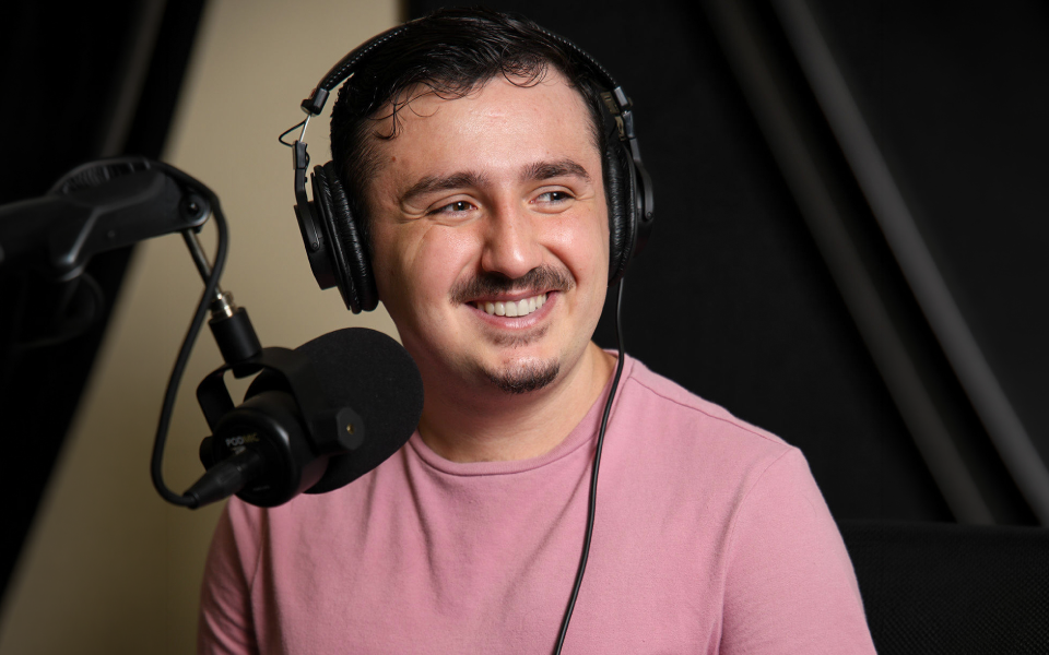 Photo of Steven Burgess ’27 at the mic